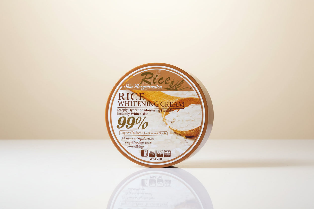 Hand holding a container of Rice Whitening Cream with a blurred indoor background