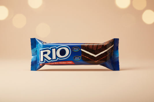Rio chocolate bar packaging on a beige background with blurred lights