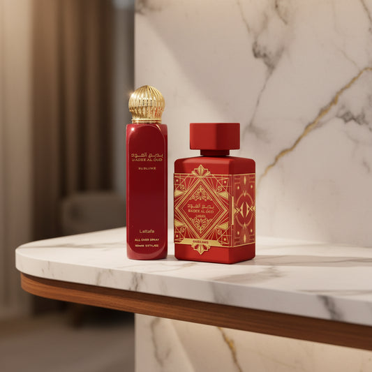 Two red Lattafa perfume bottles with gold accents on a white background