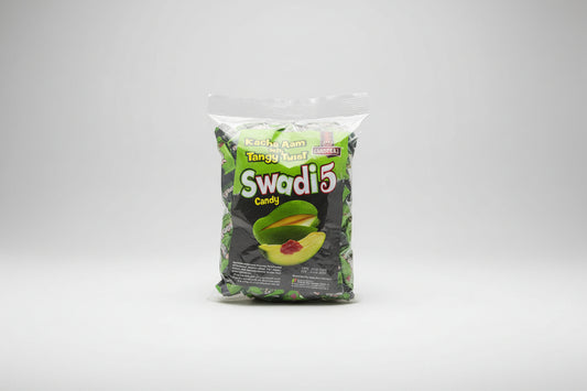 Packaged candy labeled 'Kacha Aam' with 'Swadi 5' branding on a textured surface.