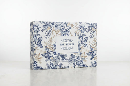 Floral-patterned box with 'Pali Street' branding on a grassy surface.